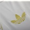 tunique-real-madrid-design-dragon-or-pour-supporter-du-club-version-collector-2425 tunika Real Madrid design guld drage til supportere af klubben version collector 2425